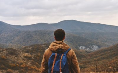 Man looking out at mountains